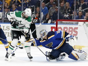 Dallas Stars' Alexander Radulov (47) pressures the net as St. Louis Blues goaltender Jordan Binnington (50) attempts to clear an airborne puck Thursday, April 25, 2019, in St. Louis.