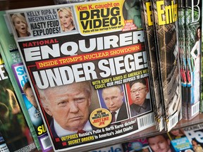 This July 12, 2017, file photo shows the cover of an issue of the National Enquirer featuring President Donald Trump at a store in New York. (AP Photo/Mary Altaffer, File)