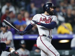 Atlanta Braves' Nick Markakis hits against Colorado Rockies starting pitcher Kyle Freeland Monday, April 8, 2019, in Denver. (AP Photo/David Zalubowski)