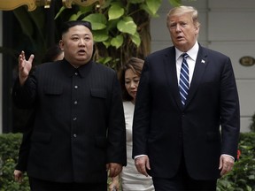In this Thursday, Feb. 28, 2019, file photo, U.S. President Donald Trump and North Korean leader Kim Jong Un take a walk after their first meeting at the Sofitel Legend Metropole Hanoi hotel, in Hanoi.