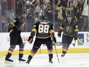 Vegas Golden Knights right wing Mark Stone, left, celebrates after scoring against the San Jose Sharks during the first period of Game 3 of an NHL first-round hockey playoff series game, Sunday, April 14, 2019, in Las Vegas.