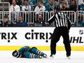 Joe Pavelski of the San Jose Sharks lies on the ice after a hard hit by the Vegas Golden Knights in the third period in Game Seven of the Western Conference First Round during the 2019 NHL Stanley Cup Playoffs at SAP Center on April 23, 2019 in San Jose, Calif.
