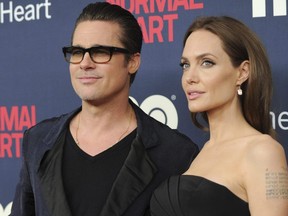 In this May 12, 2014 file photo, Brad Pitt and Angelina Jolie attend the premiere of HBO Films' "The Normal Heart" at the Ziegfeld Theatre in New York.