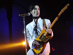 This file photo taken on Oct. 11, 2009 shows Prince performing at the Grand Palais in Paris.