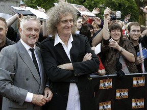 In this Sept. 13, 2010 file photo, members of the rock band Queen, Roger Taylor, front left, and Brian May, front right, pose during a meeting with fans to promote the musical "We Will Rock You" in Berlin, Germany. (AP Photo/Michael Sohn, File)