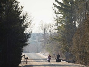 A family of four from Pakistan walk down Roxham Road in Champlain, N.Y. towards the US-Canada border on Feb. 28, 2017.