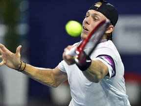 Denis Shapovalov hits a forehand to Roger Federer during the semifinals of the Miami Open Friday, March 29, 2019, in Miami Gardens, Fla. (AP Photo/Jim Rassol)