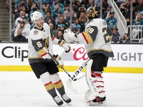 Vegas Golden Knights' Colin Miller, left, celebrates his goal with goaltender Marc-Andre Fleury (29) during the first period against the San Jose Sharks in Game 2 of an NHL hockey first-round playoff series Friday, April 12, 2019, in San Jose, Calif.
