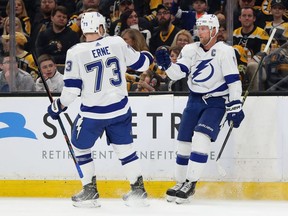 Lightning captain Steven Stamkos (right) celebrates with Adam Erne (left) after scoring a goal against the Bruins during second period NHL action at TD Garden in Boston on Saturday, April 6, 2019.
