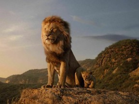 This image released by Disney shows the characters Mufasa, voiced by James Earl Jones, left, and Simba, voiced by JD McCrary, in a scene from "The Lion King," directed by Jon Favreau. (Disney via AP) ORG XMIT: NYET107