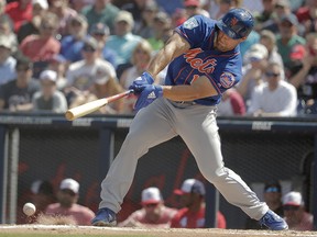 New York Mets' Tim Tebow (15) bats during a spring training game against the Washington Nationals, Thursday, March 7, 2019, in West Palm Beach, Fla. (AP Photo/Brynn Anderson)