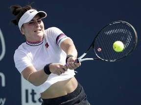 Bianca Andreescu returns to Anett Kontaveit, of Estonia, during the Miami Open tennis tournament, Monday, March 25, 2019, in Miami Gardens, Fla. An injury to rising Canadian tennis star Andreescu will keep her off the country's Fed Cup team for a World Group playoff against reigning champion Czech Republic later this month.