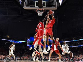 Norense Odiase and Jarrett Culver of the Texas Tech Red Raiders battle for a rebound against the Michigan State Spartans in the second half during the 2019 NCAA Final Four semifinal at U.S. Bank Stadium on April 6, 2019 in Minneapolis.