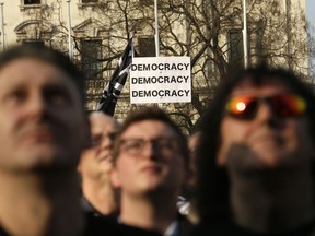Pro-Brexit leave the European Union supporters attend a rally in Parliament Square after the final leg of the "March to Leave" in London, Friday, March 29, 2019.