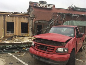 A damaged pickup truck sits in the parking lot of a strip mall that was destroyed by a deadly tornado that tore through the northern Louisiana city of Ruston early Thursday, April 25, 2019. (Jonathan Elmer/The Tech Talk via AP)