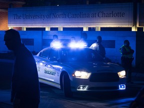 Police secure the main entrance to UNC Charlotte after a fatal shooting at the school, Tuesday, April 30, 2019, in Charlotte, N.C. (AP Photo/Jason E. Miczek)