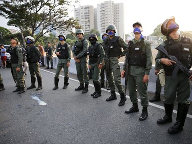 Uprising soldiers stands outside La Carlota air base in Caracas, Venezuela, Tuesday, April 30, 2019.