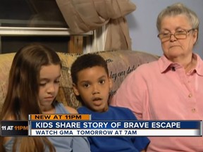 Eight-year-old Chance (middle) is credited in saving his older sister, Skyler as an alleged heroin addict attempted to steal the car of their great grandmother, Nina Coburn (right). (YouTube/WCBO)