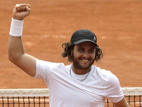 In this May 28, 2018 file photo, Argentina's Marco Trungelliti riases his fist after defeating Australia's Bernard Tomic during the French Open at Roland Garros stadium in Paris. (AP Photo/Alessandra Tarantino, File)