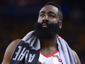 James Harden of the Houston Rockets walks back onto the court after he was poked in the left eye by Draymond Green #23 of the Golden State Warriors in Game Two of the Second Round of the 2019 NBA Western Conference Playoffs at ORACLE Arena on April 30, 2019 in Oakland, California. NOTE TO USER: User expressly acknowledges and agrees that, by downloading and or using this photograph, User is consenting to the terms and conditions of the Getty Images License Agreement.