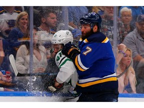 Blues forward Pat Maroon takes Stars counterpart Ben Lovejoy into the boards during Game 7 of the Western Conference Second Round playoff series at the Enterprise Center on Tuesday night in St. Louis.