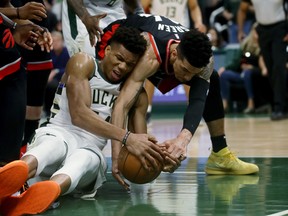 Giannis Antetokounmpo of the Milwaukee Bucks and Danny Green of the Toronto Raptors battle for a loose ball in the fourth quarter in Game One of the Eastern Conference Finals in Milwaukee last night. Getty Images Jonathan Daniel/Getty Images)