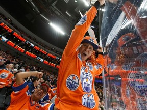 Fans celebrate Edmonton Oilers' Leon Draisaitl (29) game winning goal over the New York Rangers during a NHL game at Rogers Place in Edmonton, on Monday, March 11, 2019.