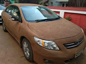 An Indian woman decided that covering her car in cow poop would keep it cool from the summer heat. (Facebook)