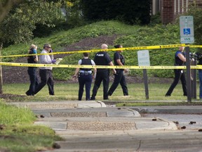 Police work the scene where eleven people were killed during a mass shooting at the Virginia Beach city public works building, Friday, May 31, 2019 in Virginia Beach, Va.