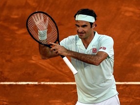 Switzerland's Roger Federer celebrates after winning a ATP Madrid Open round of 64 tennis match against France's Richard Gasquet at the Caja Magica in Madrid on May 7, 2019. (Photo by OSCAR DEL POZO / AFP)OSCAR DEL POZO/AFP/Getty Images