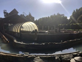 In this Saturday, May 25, 2019, photo released by the Riverside Fire Department shows a log ride that malfunctioned at Castle Park in Riverside, Calif. Authorities say three members of a family were injured, one critically, when they were ejected from the log ride at a California amusement park. Officials say the ride malfunctioned and one of the log-shaped vessels overturned at Castle Park in Riverside. Riders were thrown from the vessel and trapped in the water. Fire Capt. Brian Guzzetta says a pump apparently malfunctioned, preventing the flow of water onto the track. He says when the log descended there wasn't enough water to slow it down. (Riverside Fire Department via AP) ORG XMIT: LA714