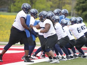 The Argos’ offensive line practises at training camp at York University yesterday. (Jack Boland/Toronto Sun)