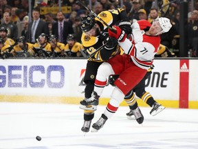 Bruins forward David Backes (left) checks Lucas Wallmark of the Carolina Hurricanes during their Eastern Conference final. Boston swept the series 4-0. (Bruce Bennett/Getty Images)