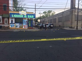 This photo provided by 3 CBS Philadelphia shows police canvasing the scene of a shooting in Trenton, N.J. on Saturday, May 25, 2019.  (3 CBS Philadelphia via AP)