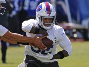 Buffalo Bills running back Senorise Perry  gets a handoff during an NFL football organized team activity Tuesday, May 21, 2019, in Orchard Park N.Y.