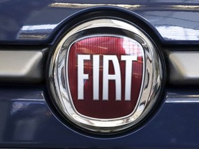 FILE - In this Feb. 14, 2019, file photo, this is the Fiat logo is mounted on a 2019 500 L on display at the 2019 Pittsburgh International Auto Show in Pittsburgh.