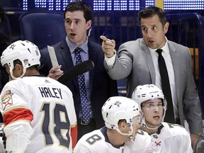 Florida Panthers head coach Bob Boughner, top right, and assistant coach Paul McFarland, left, watch from the bench on September 19, 2017, in Nashville, Tenn. (THE CANADIAN PRESS/AP, Mark Humphrey)