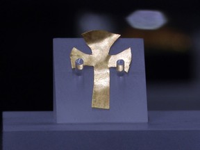 A gold foil cross uncovered at an Anglo-Saxon burial site in the village of Prittlewell in 2003 on display at Southend Central Museum in Southend, England, Thursday, May 8, 2019.