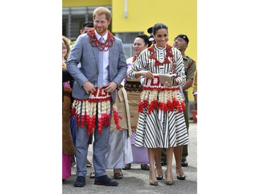 In this Friday, Oct. 26, 2018 file photo, Prince Harry and Meghan, the Duchess of Sussex visit an exhibition of Tongan handicrafts, mats and tapa cloths at the Fa'onelua Convention Centre in Nuku'alofa, Tonga.