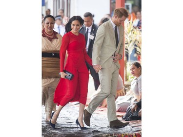 In this Thursday, Oct. 25, 2019 file photo, Prince Harry and Meghan, Duchess of Sussex in arrive at Fua'amotu Airport in Tonga.