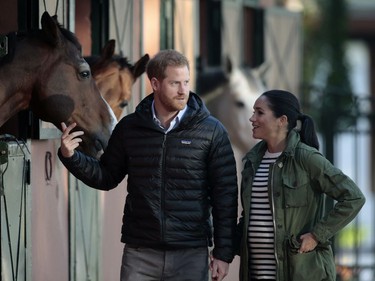 In this Monday, Feb. 25, 2019 file photo, Prince Harry and Meghan, Duchess of Sussex, walk together during a visit to the Moroccan Royal Equestrian Sports Complex in Rabat, Morocco.