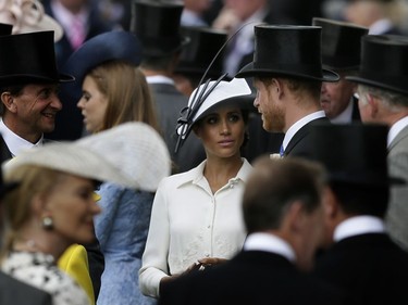 In this Tuesday, June 19, 2018 file photo, Prince Harry and Meghan, Duchess of Sussex, arrive on the first day of the Royal Ascot horse race meeting in Ascot, England.