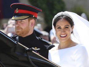 In this Saturday, May 19, 2018 file photo, Britain's Prince Harry and his wife Meghan Markle leave after their wedding ceremony, at St. George's Chapel in Windsor Castle in Windsor, near London, England. Sunday, May 19, 2019 marks the first wedding anniversary of the besotted couple.