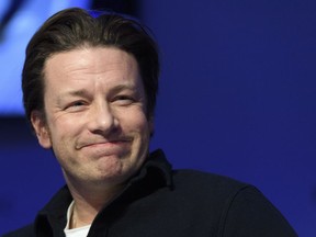 In this Wednesday, Jan. 18, 2017 file photo, British chef Jamie Oliver attends a panel session during the 47th annual meeting of the World Economic Forum, WEF, in Davos, Switzerland.