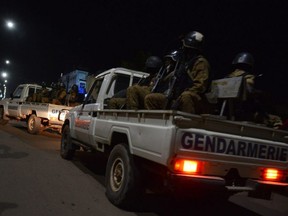 Burkina Faso gendarmes and army forces patrol on Aug. 13, 2017 as soldiers launch an operation against suspected jihadists in Burkina Faso after gunmen attacked a cafe in the capital Ouagadougou.