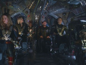 This image released by Disney shows, from left, Brie Larson, Scarlett Johansson, Don Cheadle, Chris Hemsworth, Chris Evans and the character Rocket, voiced by Bradley Cooper, in a scene from "Avengers: Endgame."