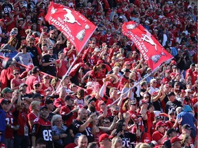 Calgary Stampeders fans cheer their team after they beat the Edmonton Eskimos 39-18 in the Labour Day Classic at McMahon Stadium, Monday Sept. 4, 2017.