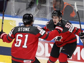 Canada's Mark Stone celebrates with Troy Stecher, right, after scoring during the World Hockey Championship semifinal against the Czech Republic at the Ondrej Nepela Arena in Bratislava, Slovakia, Saturday, May 25, 2019. (AP Photo/Petr David Josek)