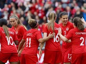 Team Canada's Shelina Zadorsky (4) and Christine Sinclair (12) celebrate a goal by midfielder Jessie Fleming (17) with teammates during the first half of a women's international soccer friendly against Mexico at BMO Field in Toronto, Saturday, May 18, 2019.