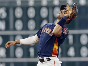 Carlos Correa of the Houston Astros make a catch on a pop fly by Jackie Bradley Jr. of the Boston Red Sox at Minute Maid Park on May 26, 2019 in Houston. (Bob Levey/Getty Images)